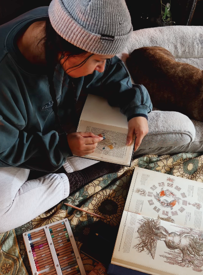 Open sketchbook with art journal drawings